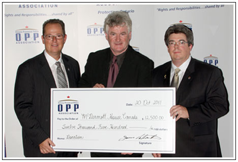 Cheque presentation to McDermott House Canada on behalf of the OPP Association on October 20th, 2011 by President Jim Christie (L) and Director Todd Provost (R). The donation was a combination of the fundraising from the OPP Association 2011 Charity Golf Tournament and a charitable donation from the OPP Association. The OPP Association is the exclusive bargaining agent representing over 9000 uniform and civilian non-commissioned Members of the Ontario Provincial Police.
